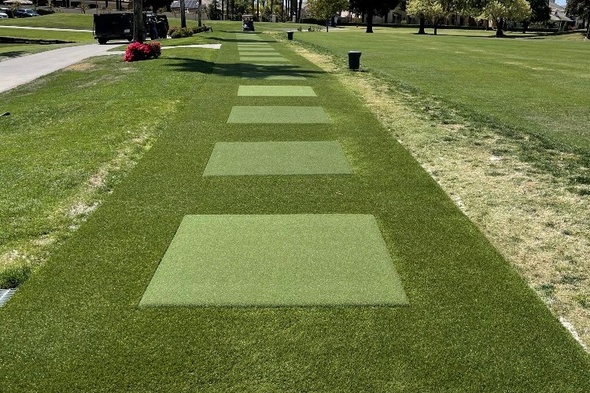 Atlanta Outdoor tee line with light green synthetic grass boxes inside a dark green synthetic grass strip